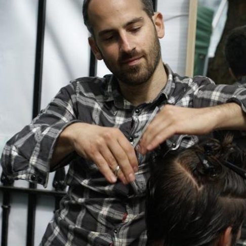 Jonny cutting a client's hair
